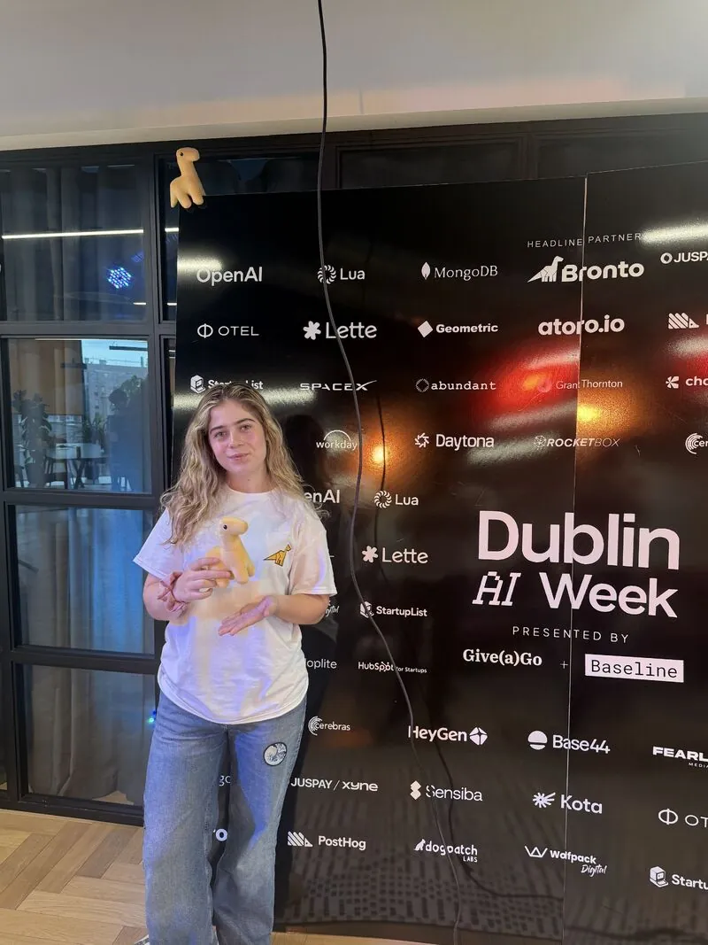 Paige at the Dublin AI Week sponsor wall